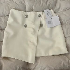 Brand new, never worn. Lost weight before getting to wear so not as fitting.